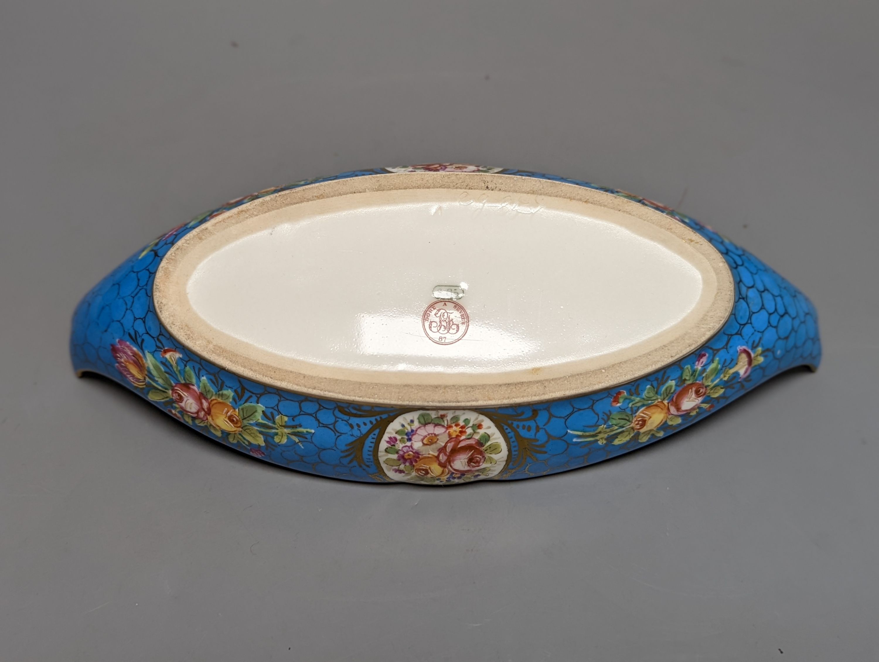 A Sevres style boat shaped dish and a Limoges circular dish, Sevres dish 27 cms wide & Limoges dish 31 cms diameter.